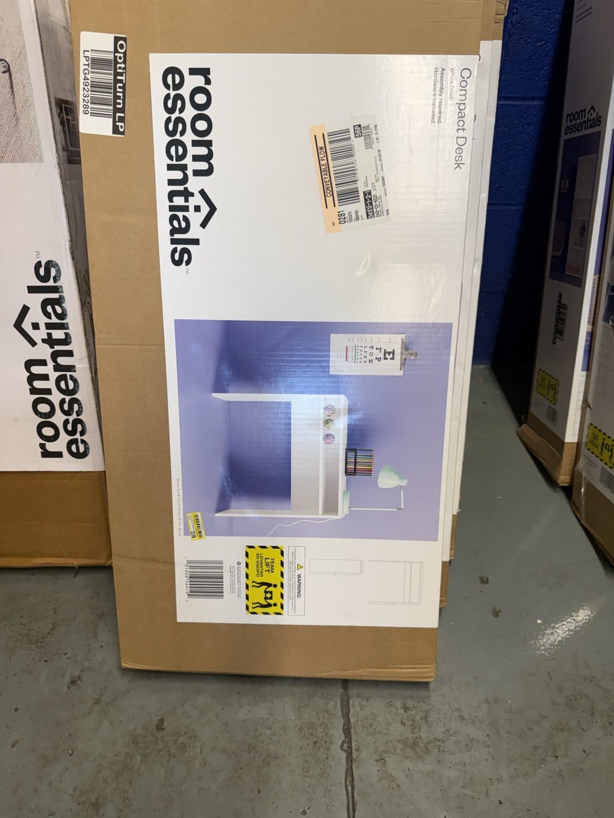 Compact desk still boxed and unopened at a discount furniture warehouse