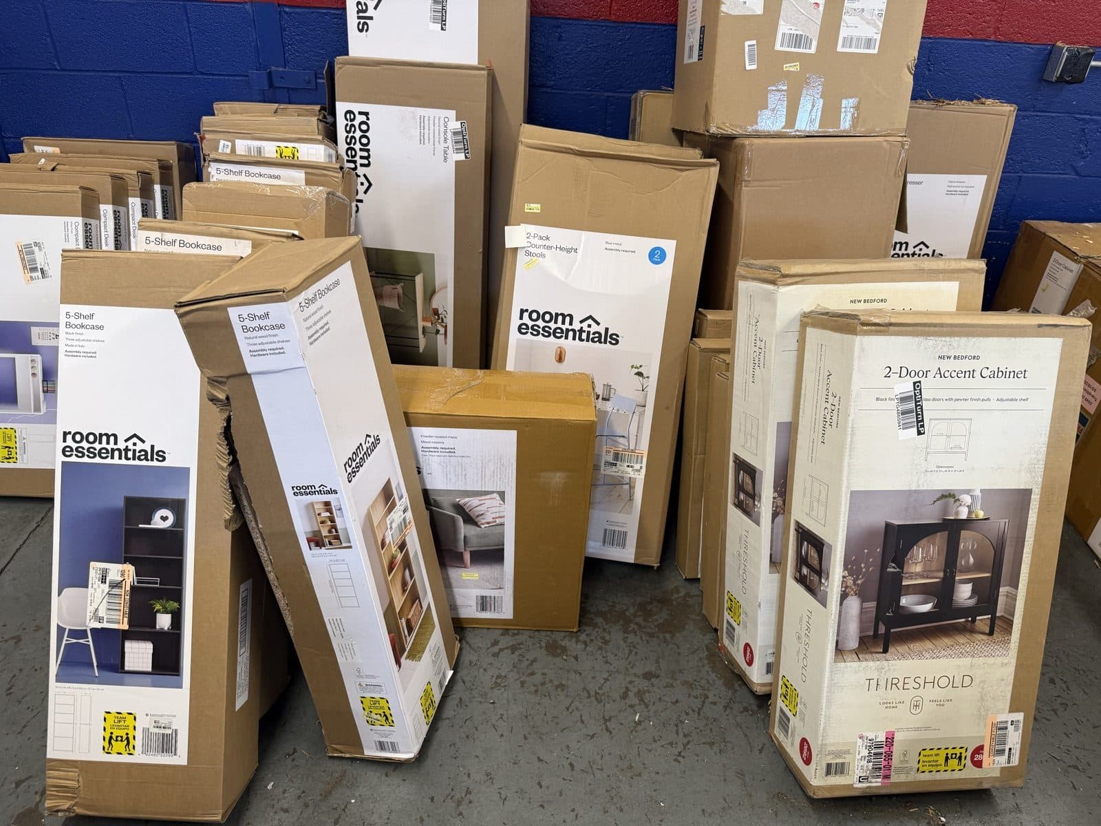 Boxed overstock furniture still wrapped on the warehouse floor in Harrisonburg VA