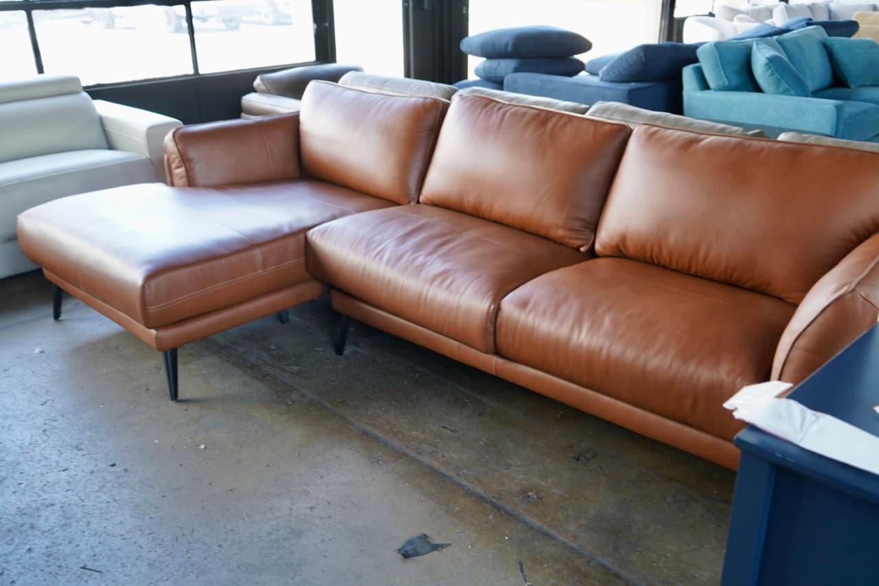 Discount leather L-shaped sectional for sale at a Harrisonburg VA furniture warehouse