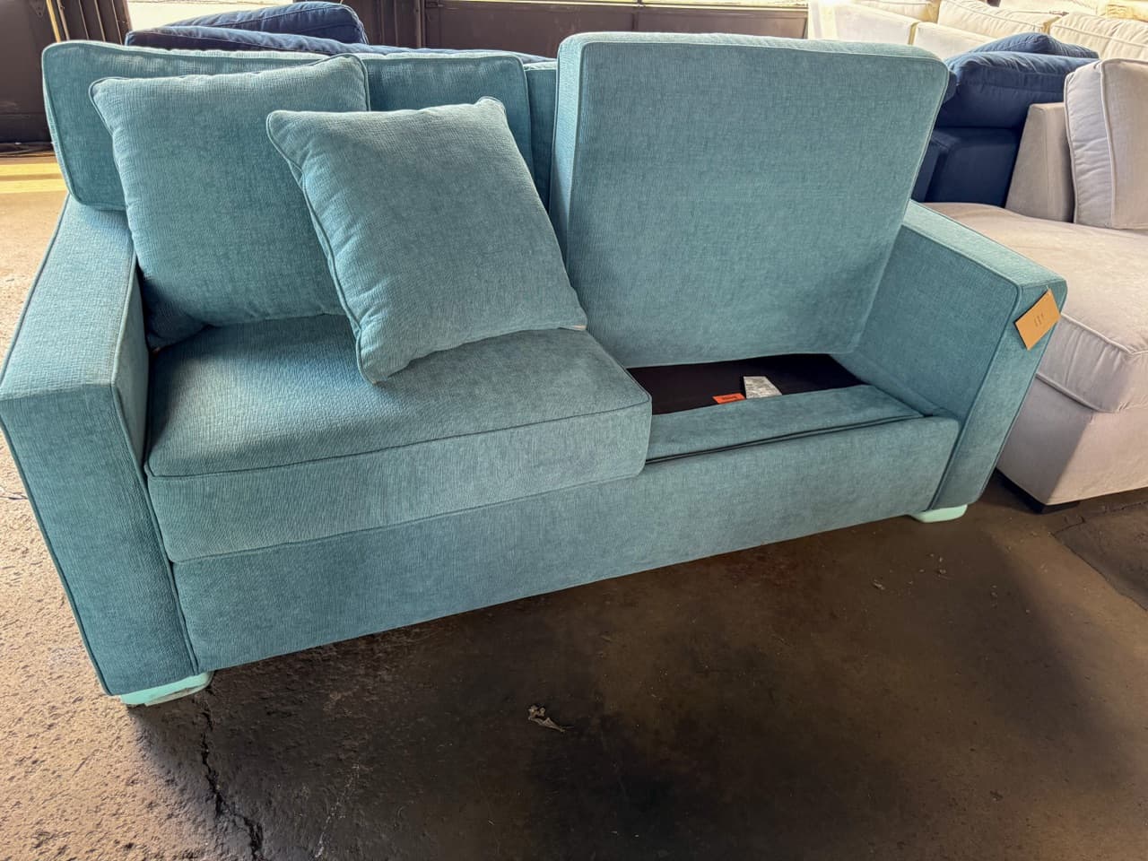 Compact discount sofa sized for an off campus apartment near JMU
